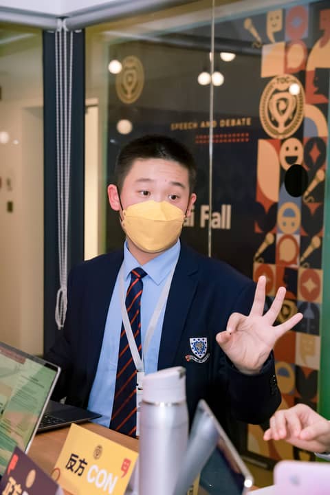 Boy speaking with mask on