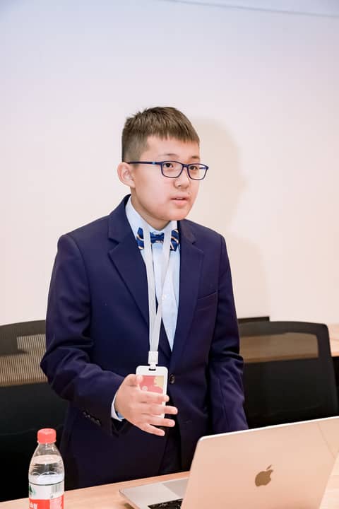 Boy in bow tie debating