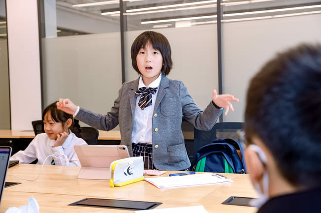 girl debating in class
